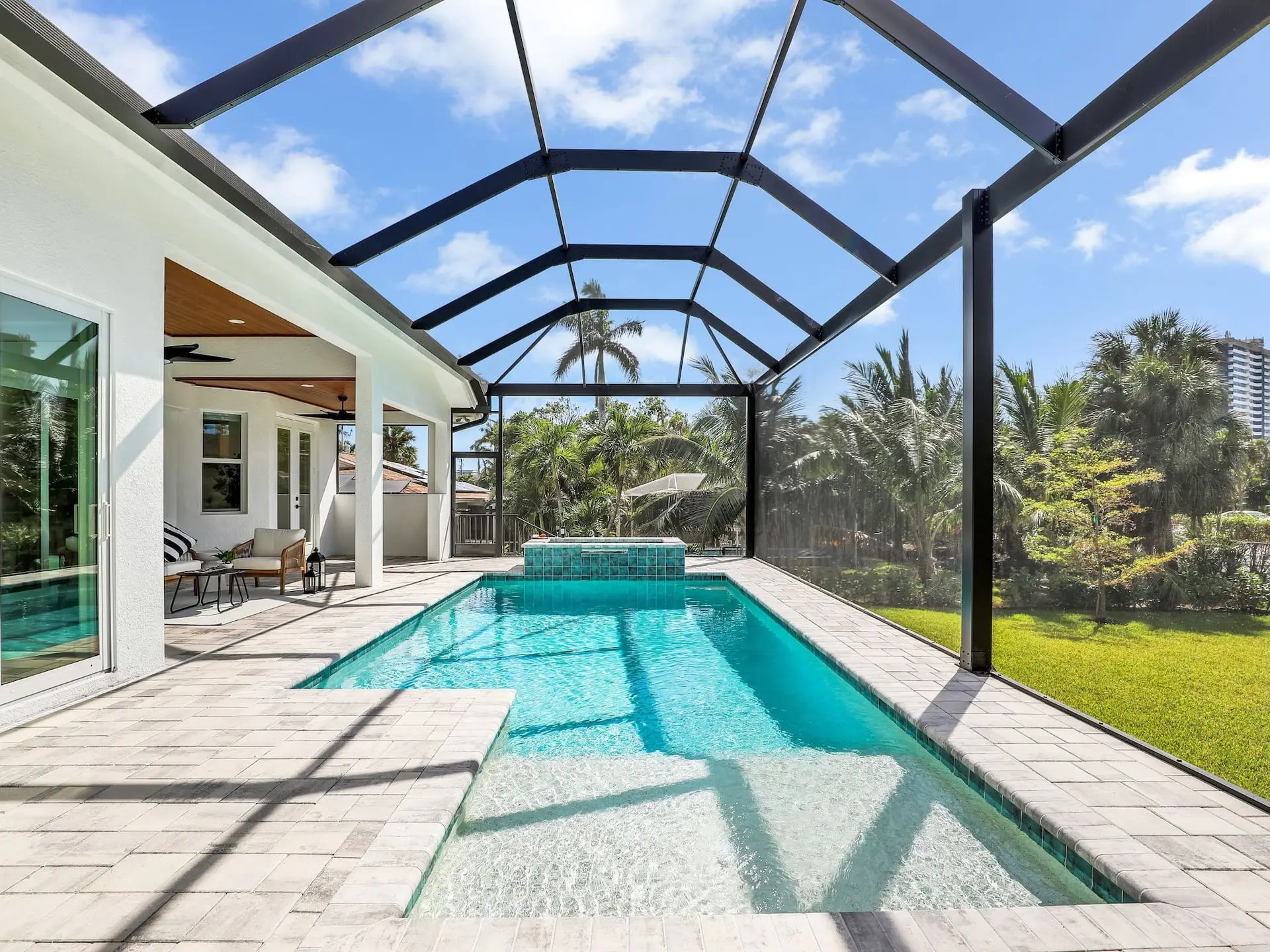 Heated saltwater pool and hot tub inside the screened lanai